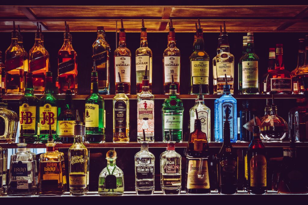 pexels photo 1283219 1283219 An array of various liquor bottles beautifully displayed on a bar shelf.